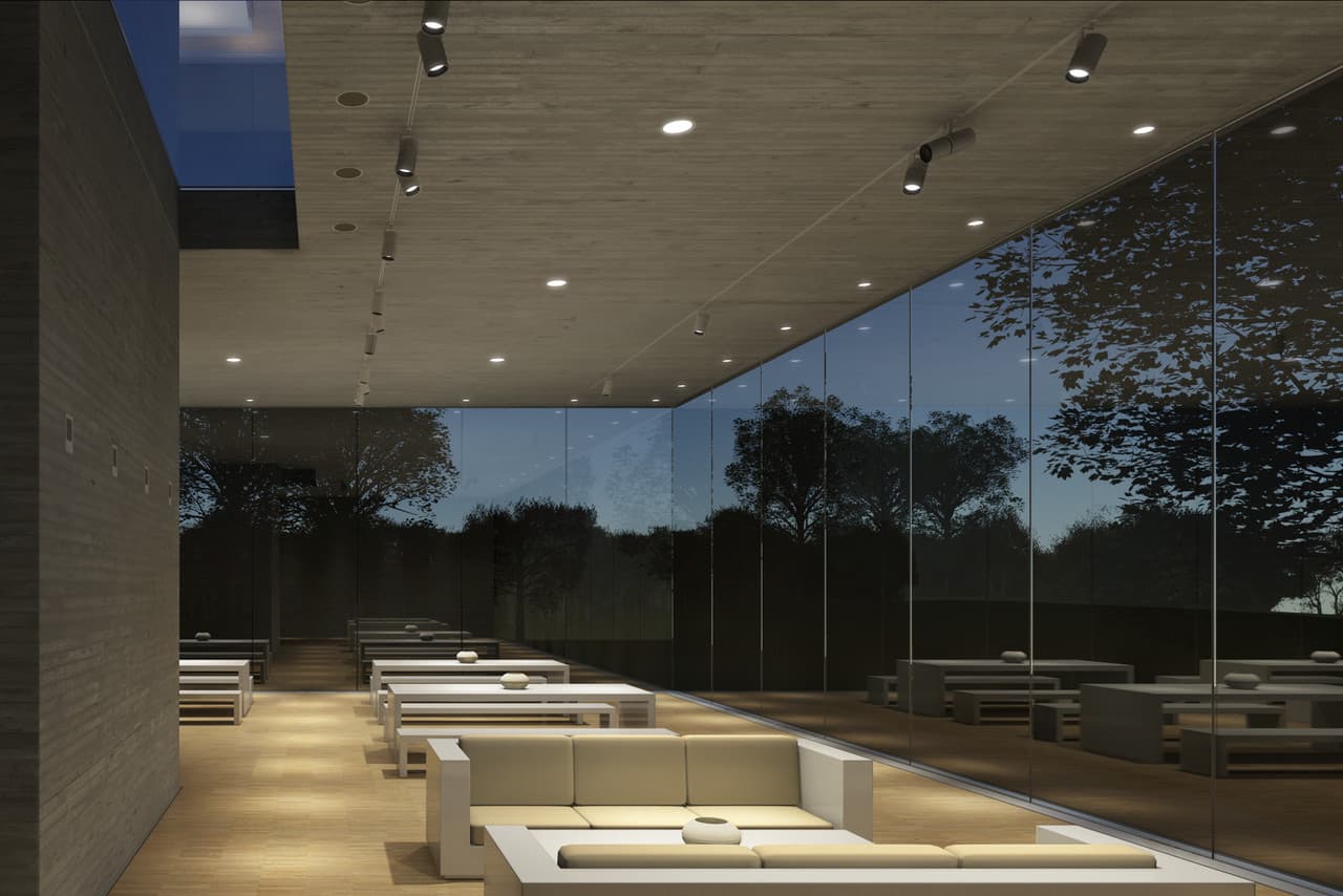 Innenraum mit ERCO Lichtlösung: Downlights und Wandfluter erzeugen eine diffuse, einladende Atmosphäre in einem modernen Raum.