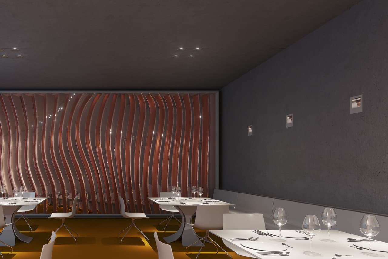 Restaurant-Innenraum mit ERCO-Beleuchtung, die Brillanz und Atmosphäre durch gezielte Lichtakzente erzeugt.
