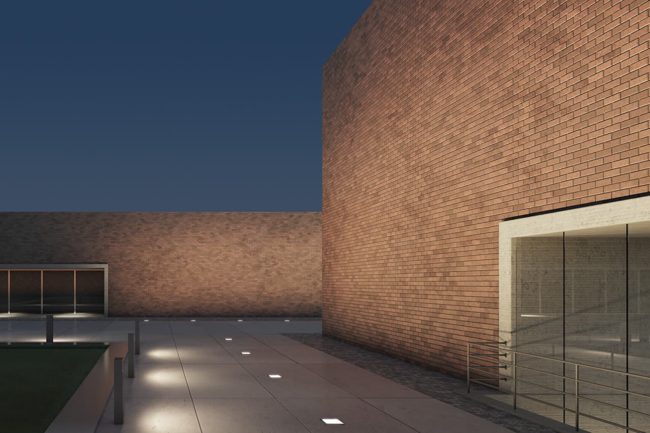 ERCO Lichtdesign: Fassade mit Bodenstrahlern, die ein räumliches Muster erzeugen. Architekturbeleuchtung.
