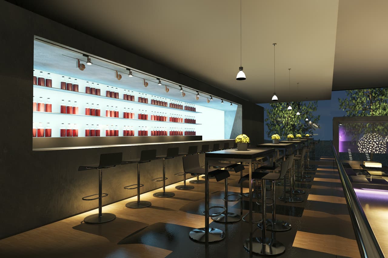 Restaurantbar mit ERCO Beleuchtung, die eine angenehme Atmosphäre für Speisen und Getränke schafft.