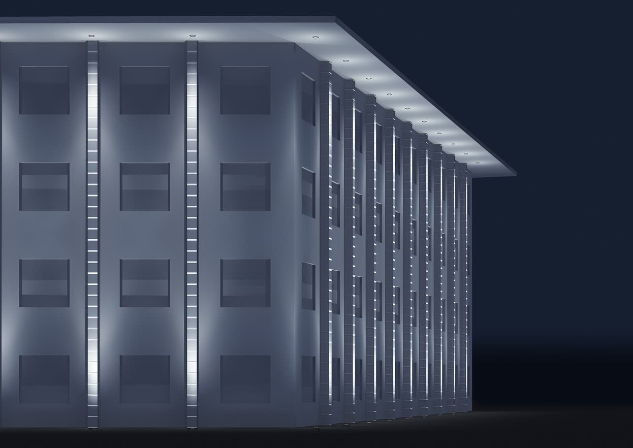 Fassadenbeleuchtung eines modernen Gebäudes mit ERCO Lichtlösungen.