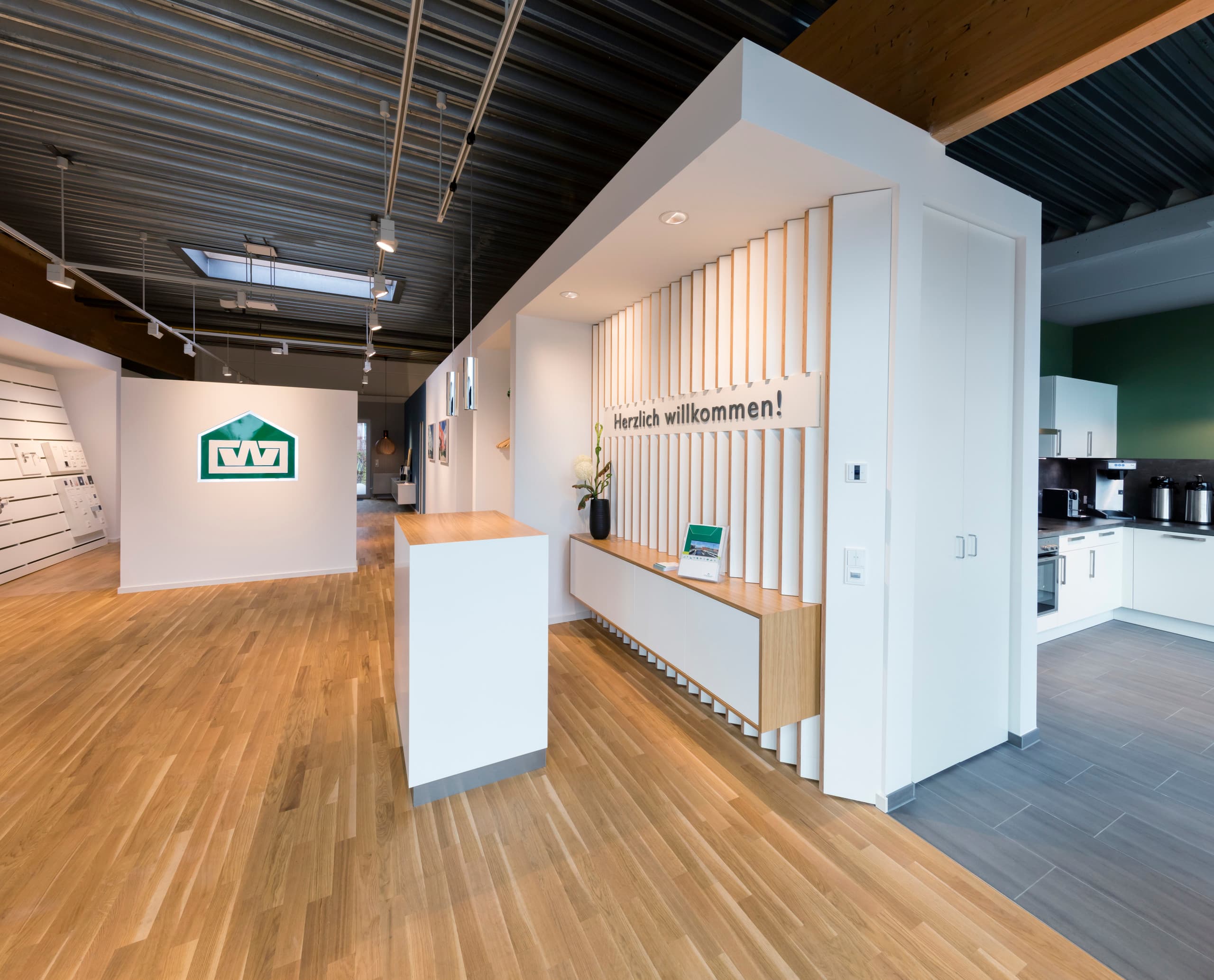 Otto Wulff Showroom: Empfangsbereich mit ERCO LED-Beleuchtung für hochwertige Markenkommunikation.