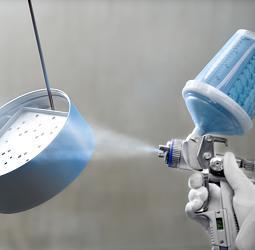 Spraying an ERCO luminaire, showcasing sustainable production and eco-design.